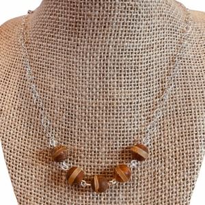 Linked ceramic beads. Silver‎ plated chain.